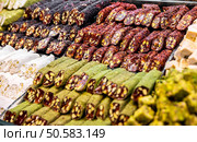 Eastern sweets in a wide range, baklava, Turkish delight. Стоковое фото, агентство Ingram Publishing / Фотобанк Лори