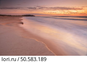 Beautiful pastel shades in the sands and water wash over this 4 second exposure at dawn sunrise, near Dee Why Lagoon and Long Reef Beach, Collaroy. Стоковое фото, агентство Ingram Publishing / Фотобанк Лори