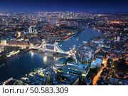 London at night with urban architectures and Tower Bridge. Стоковое фото, агентство Ingram Publishing / Фотобанк Лори