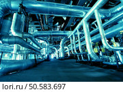 Pipes, tubes, machinery and steam turbine at a power plant                . Стоковое фото, агентство Ingram Publishing / Фотобанк Лори