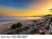 Sunset view of Copacabana beach and Avenida Atlantica in Rio de Janeiro, Brazil. Стоковое фото, агентство Ingram Publishing / Фотобанк Лори