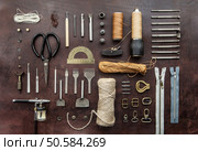 tools for homemade leathercraft on brown background. leathercraft tools. Стоковое фото, агентство Ingram Publishing / Фотобанк Лори