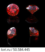 Round garnet isolated on black background. Gemstone. Стоковое фото, агентство Ingram Publishing / Фотобанк Лори