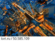 Birds eye view of a modern building at night. Traffic in the business district The Skytrain station Chong Nonsi. Modern building night view. Стоковое фото, агентство Ingram Publishing / Фотобанк Лори