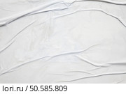 white crumpled and creased glued wrinkled paper poster texture background. Стоковое фото, агентство Ingram Publishing / Фотобанк Лори