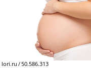Portrait of a pregnant woman holding her belly. Стоковое фото, агентство Ingram Publishing / Фотобанк Лори