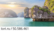 Dreamy rocks  in lagoons of Halong Bay on sunset, Vietnam. Halong Bay seascape, Vietnam. Стоковое фото, агентство Ingram Publishing / Фотобанк Лори