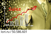 business man drawing graph of sales. Стоковое фото, агентство Ingram Publishing / Фотобанк Лори