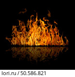 orange flame isolated on black background. Стоковое фото, агентство Ingram Publishing / Фотобанк Лори