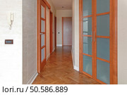 Empty Corridor With Closed Doors in Apartment. Стоковое фото, агентство Ingram Publishing / Фотобанк Лори