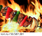 pork barbeque on flaming hot background. Стоковое фото, агентство Ingram Publishing / Фотобанк Лори
