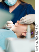 ntists with a patient during a dental intervention to girl. Стоковое фото, агентство Ingram Publishing / Фотобанк Лори