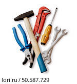 Assorted DIY tools with a red mole grip or adjustable spanner, pliers, screwdriver and pair of spanners, overhead view on white. Assorted DIY tools. Стоковое фото, агентство Ingram Publishing / Фотобанк Лори