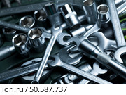 Tool. Heap of tools wrenches, nuts and bolts toned in metallic blue. Стоковое фото, агентство Ingram Publishing / Фотобанк Лори