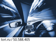 Car Speeding Concept Photo. Men Driving His Car. Speeding on the Mountains Road. Duotone Blue Color Grading. Стоковое фото, агентство Ingram Publishing / Фотобанк Лори