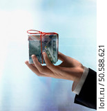 Businessman’s hand holding gift box made of Euros. 24316754. Стоковое фото, агентство Ingram Publishing / Фотобанк Лори