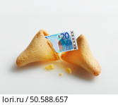 Broken fortune cookie with Euro inside. 24316791. Стоковое фото, агентство Ingram Publishing / Фотобанк Лори