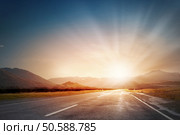 Nature landscape of sunset light above asphalt road. Sunset above road. Стоковое фото, агентство Ingram Publishing / Фотобанк Лори