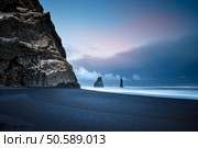 Beautiful Landscape of a Famous Black Pebbles Beach. Amazing View on the Basalt Cliffs in the Sea. Vik Myrdal. Iceland. Стоковое фото, агентство Ingram Publishing / Фотобанк Лори