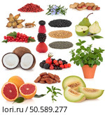 Healthy super food collection of nuts, dried and fresh fruit, herbs, and pulses, very high in antioxidants and vitamins, isolated over white background. Стоковое фото, агентство Ingram Publishing / Фотобанк Лори