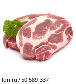 Raw pork neck chop meat with parsley herb leaves garnish isolated on white background cutout. Стоковое фото, агентство Ingram Publishing / Фотобанк Лори