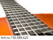 Detail of dusty classic acoustic guitar with shallow depth of field.. Detail of dusty classic acoustic guitar with shallow DOF and blur. Стоковое фото, агентство Ingram Publishing / Фотобанк Лори