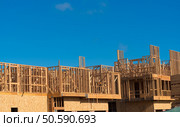 Wooden framing for construction of new condominiums, apartments or townhomes. Стоковое фото, агентство Ingram Publishing / Фотобанк Лори
