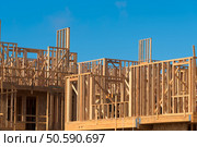 Wooden framing for construction of new condominiums, apartments or townhomes. Стоковое фото, агентство Ingram Publishing / Фотобанк Лори