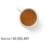 Herbal tasty aromatic tea in cup isolated on empty white background. Beverages concept. Herbal tasty aromatic tea in cup isolated on empty white background. Стоковое фото, агентство Ingram Publishing / Фотобанк Лори