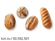 Pattern from freshly baked crunchy different types of bread on isolated white background. Top view. Pattern from freshly baked crunchy different types of bread on isolated. Стоковое фото, агентство Ingram Publishing / Фотобанк Лори
