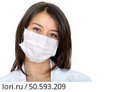 Female doctor with facemask isolated over a white background. Стоковое фото, агентство Ingram Publishing / Фотобанк Лори