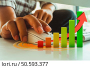 Check the trades from the graph showing the products. Business concept. Стоковое фото, агентство Ingram Publishing / Фотобанк Лори
