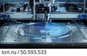 Semiconductor Wafer after Dicing Process. Silicon Dies are Being Extracted by Pick and Place Machine. Computer Chip Manufacturing, Packaging Process. Стоковое фото, агентство Ingram Publishing / Фотобанк Лори