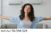 Woman stretching arms, feeling freedom and happiness at home. Стоковое AI-видео, аниматор Юрий Поздников / Фотобанк Лори
