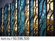 Intricate modern architecture with geometric glass panels. Стоковое AI-изображение, AI-художник Иван Рябоконь / Фотобанк Лори