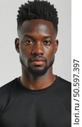 Attractive sexy African American young man wearing a blank cotton black t-shirt isolated on white studio background. Стоковое AI-видео, аниматор Sergey Grishin / Фотобанк Лори