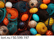 Colorful fishing nets and floats creating a vibrant marine still life. Стоковое AI-изображение, AI-художник Иван Рябоконь / Фотобанк Лори
