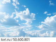 Bright sun shining through white clouds in blue sky. Стоковое AI-изображение, AI-художник Иван Рябоконь / Фотобанк Лори