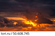 Glimmering Sunset Through the Dramatic Clouds in the Evening. Стоковое фото, фотограф Aleksandr Golubev / Фотобанк Лори