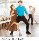 Tango performed by young couple in choreographic studio. Стоковое фото, фотограф Яков Филимонов / Фотобанк Лори