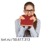 Girl biting teeth in the book cover. Стоковое фото, фотограф Дмитрий Киселёв / Фотобанк Лори