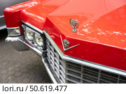 BERLIN - MAY 10, 2025: Close-up of the front grille, hood and emblem of a classic Cadillac DeVille. Classic Days Berlin. Редакционное фото, фотограф Sergey Kohl / Фотобанк Лори