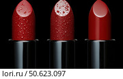 Row of passion red lipsticks displayed against black background. Beauty industry and fashion concept. Copy space. Advertisement for makeup artists. Стоковое AI-изображение, AI-художник Ирина Михайличенко / Фотобанк Лори
