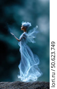 Beautiful fairy conjuring magic with glowing hands in an enchanted forest. Стоковое AI-изображение, AI-художник Юрий Поздников / Фотобанк Лори
