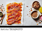 Delicious cured salmon with herbs and spices on rustic table. Стоковое AI-изображение, AI-художник Мария Фадеева / Фотобанк Лори
