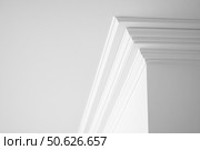 Ceiling close-up. Classic interior. LED Retrofit Bulb into Ceiling Fixture. Cornice. Installing. Decorative Ceiling crown molding intersection. Wall Corner Architecture Decor. Angular ceiling skirting. Стоковое AI-изображение, AI-художник Марина Демидюк / Фотобанк Лори