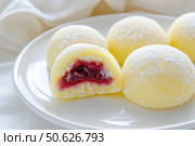 Delicious Japanese moti desserts. Close up. Asian rice daifuku dessert sweet mochi. Cut in half with filling. Traditional dessert mochi ice cream. Colorful rice cake. Fukashi manju. Culinary delights. Стоковое AI-изображение, AI-художник Марина Демидюк / Фотобанк Лори