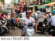 Morning Commute With Motorbikes and Pedestrians in Ho Chi Minh City (2024 год). Редакционное фото, фотограф Aleksandr Golubev / Фотобанк Лори