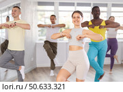 European girl with team of like-minded multinational people learn to elements of electro dance. Стоковое фото, фотограф Яков Филимонов / Фотобанк Лори