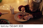 Children Eating Birthday Cake Slice on a Birthday Party at Home. Siblings, girls and a boy together celebrating a party, eating cake sitting at festive table. Little Kid Celebration. Surprise. Low key. Стоковое видео, видеограф Марина Демидюк / Фотобанк Лори